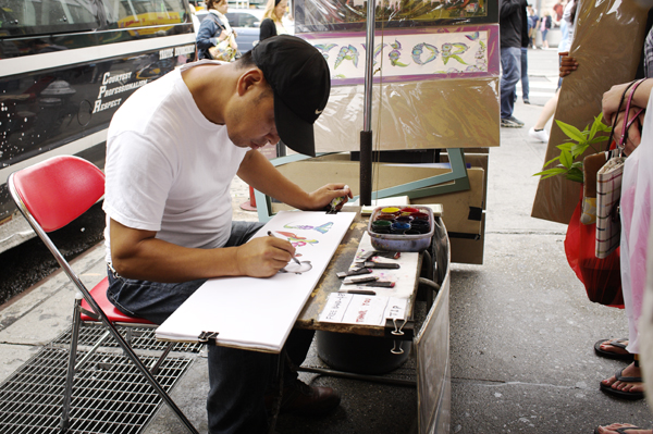 Street artist, Chinatown, NYC